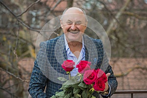 Older men with bouquet of roses, lifestyle of old men