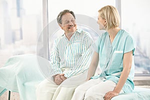 Older patient talking to nurse