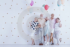 Older people with balloons