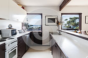 Older style retro 70s kitchen in Australian beach house