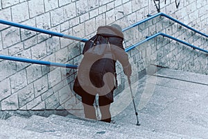 Older woman on the city stairs