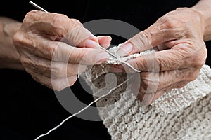 Older woman crocheting