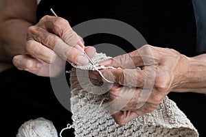 Older woman crocheting