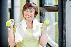 Older woman exercising indoors