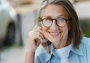 Older Woman in Glasses and Blue Shirt