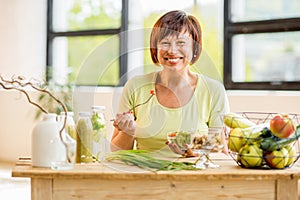 Older woman with healthy food indoors