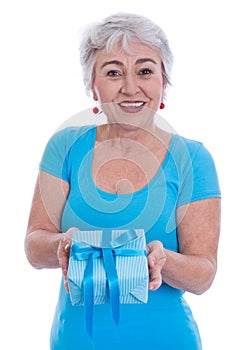 Older woman isolated in white with turquoise shirt and present