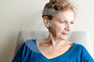 Older woman looking pensive