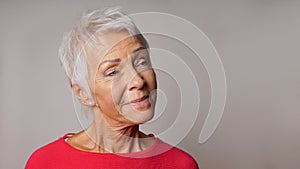 Older woman looking pleased photo