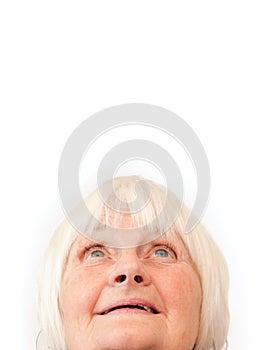 Older woman looking up at copyspace