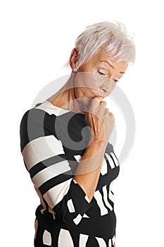 Older woman looking worried and forgetful