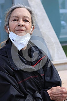 older woman with the mask down