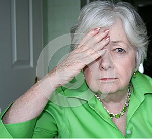 Older Woman with One Hand to Head