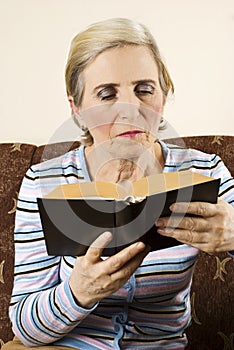 Older woman reading a book