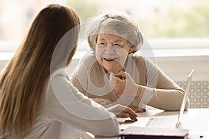 Older woman receives professional medical consultation during visit in clinic