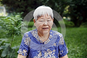 Older woman's portrait outdoor