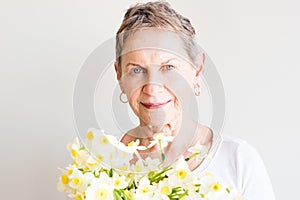 Older woman with spring flowers