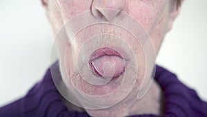 Older woman sticking out her tongue