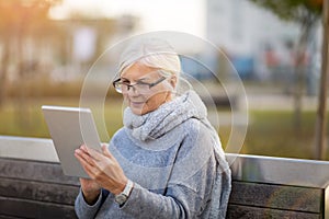 Older woman using digital tablet