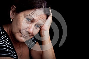 Older woman with a very sad expression