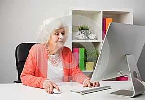 Older woman working in the office