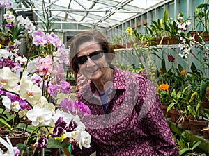 Older Women Gardener with Orchids