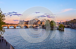 The oldest bridge  Pont Neuf  across Seine River and historic buildings of Paris France at sunset. April 2019