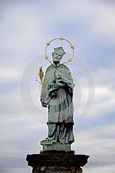 Oldest statue sculpture on Charles Bridge in Prague depicting St. John of Nepomuk