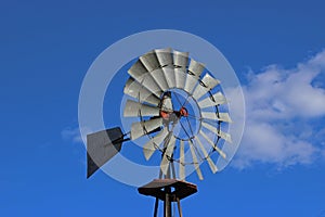 Oldfashioned Windmill against blue sky