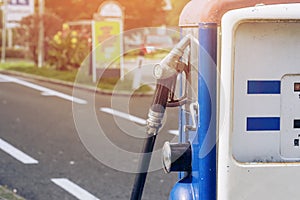 Oldtime or vintage Red white blue color fuel gasoline station box and dispenser in blur Europe background. S