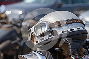 Oldtimer motorcycle helmet lies on a motorcycle