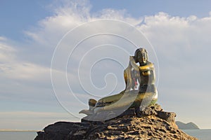 Ole mermaid statues on the beach and sky background. Landmark of