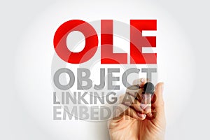 OLE Object Linking and Embedding - technology that allows embedding and linking to documents and other objects, acronym text