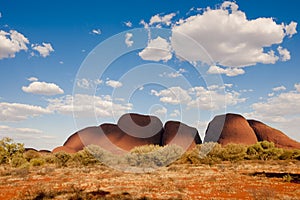 The Olgas, Kata Tjuta, Australia, with blue sky and white clouds photo