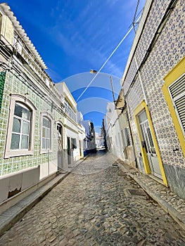 A typical street on Olhao, a city on Algarve region, Portugal.