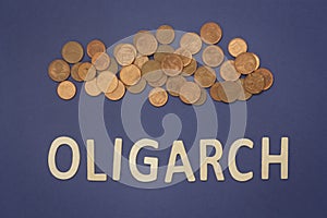 Oligarch written with wooden letters on a blue background