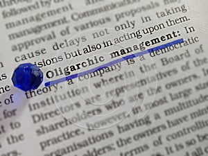 oligarchic management word written on book article image with underlined text form
