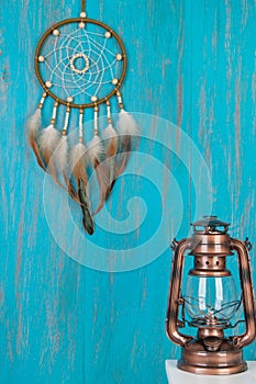 Olive dream catcher on blue