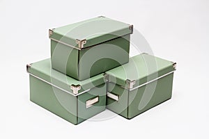 Olive green storage boxes in a stack