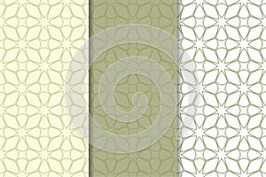 Olive green and white geometric ornaments. Set of seamless patterns