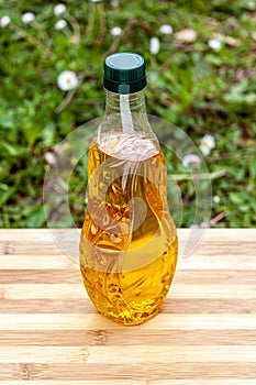 Olive oil bottle on cutting board