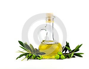 Olive oil bottle and olive branch isolated on white.