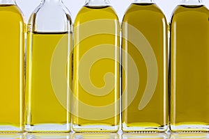Olive Oil Bottles in a Row and Different Shades