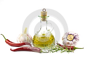 Olive oil, garlic, hot pepper and rosemary branch isolated on white background