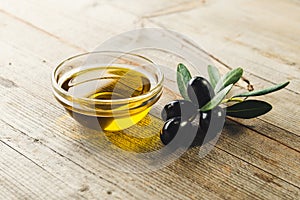 Olive oil with leaves and olives