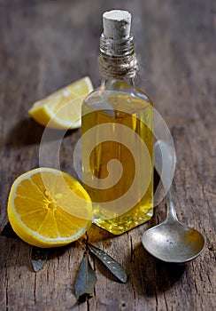 Olive oil and lemon fruits on the wooden table