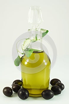 Olive oil, olives and branch