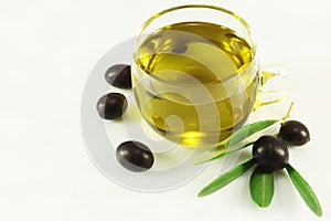 Olive oil, olives and branch