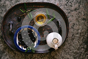 Olive oil with Olives in ceramic plate