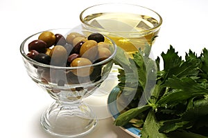 Olive oil, olives and green salad